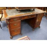 A Continental mahogany kneehole desk W.148cm