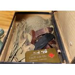 A suitcase containing WWII militaria and helmet