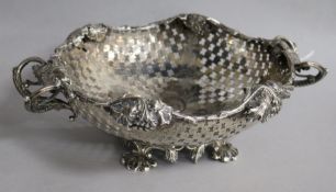 A mid 19th century Austrian pierced silver two handled fruit bowl, 26.5cm over handles, 12.5 oz.