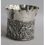 A Victorian repousse silver bottle coaster by William Comyns, London, 1892, 97mm, 4.5 oz.