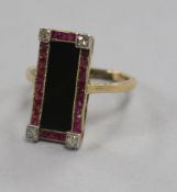 An Austro-Hungarian yellow metal, black onyx, ruby and diamond set tablet ring, size K.