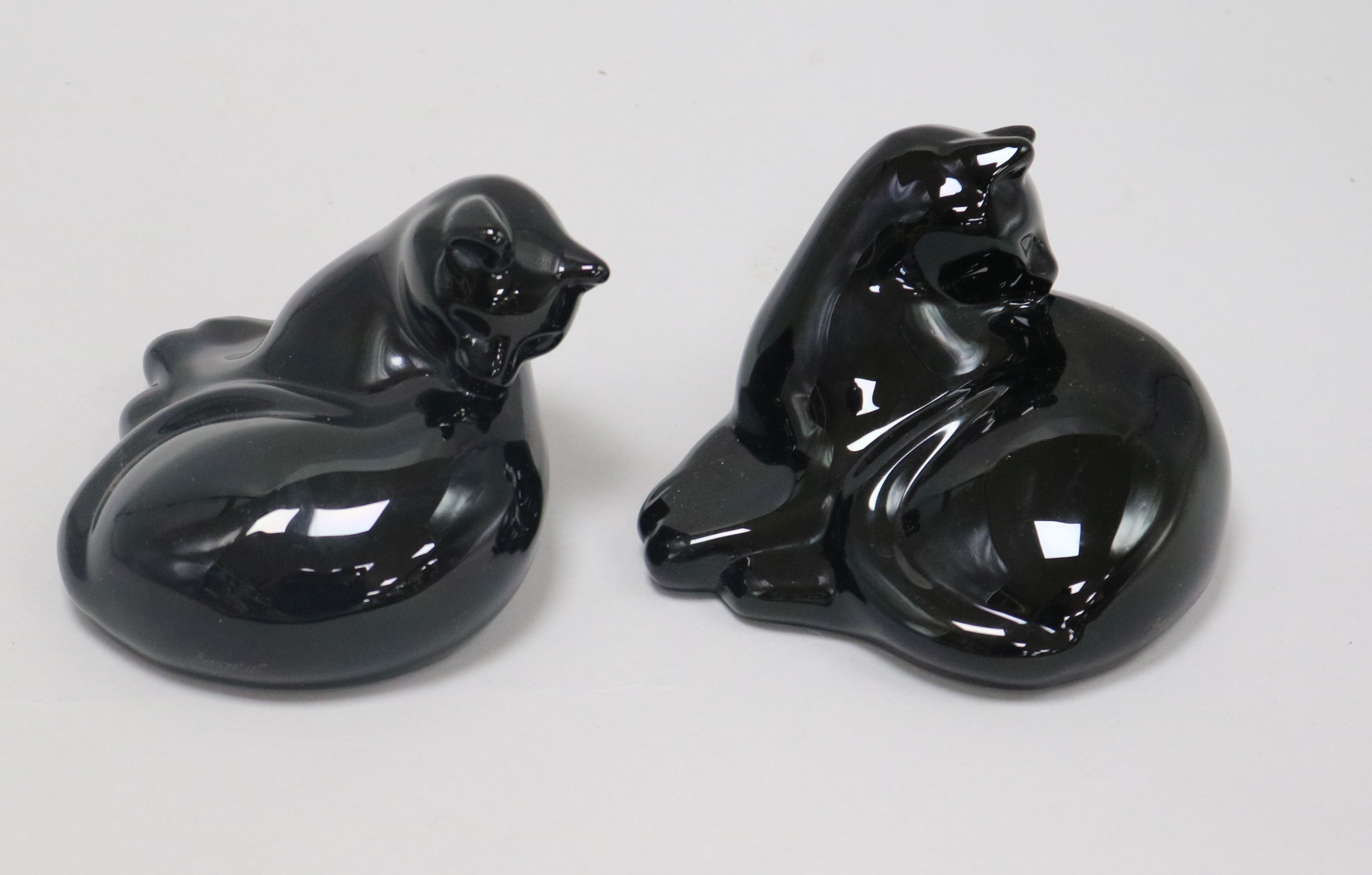 Two black glass cats, signed Baccarat