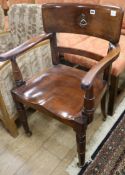 A Victorian mahogany desk chair with painted armorial