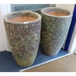 A pair of volcanic style pots W.45cm