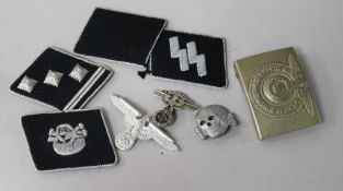 A German SS buckle and badges