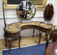 A 1930's chinoiserie dressing table with side revolving mirrors W.160cm