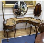 A 1930's chinoiserie dressing table with side revolving mirrors W.160cm