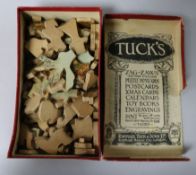 A small cased travelling chess set and a boxed wooden puzzle