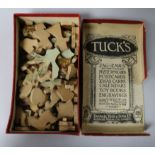 A small cased travelling chess set and a boxed wooden puzzle