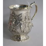 A Victorian embossed silver christening mug, George Angel, London, 1859, 12cm.