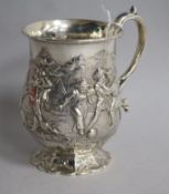 A Victorian embossed silver christening mug, George Angel, London, 1859, 12cm.