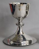 A modern planished silver chalice and paten, J. Wippell & Co Ltd,London, 1958, 14 oz.