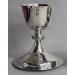 A modern planished silver chalice and paten, J. Wippell & Co Ltd,London, 1958, 14 oz.