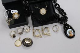 A group of mixed jewellery including pendants, pique brooch and rings.