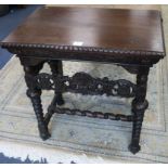 A Flemish style carved walnut side table, with carving matching the throne chair selling as Lot