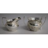 An Edwardian silver cream jug and sugar bowl, Z. Barraclough & Sons, London, 1909, 10 oz.