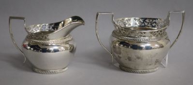 An Edwardian silver cream jug and sugar bowl, Z. Barraclough & Sons, London, 1909, 10 oz.