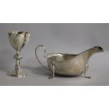 A late Victorian silver communion chalice and a later silver sauceboat, 7 0z.