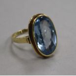 A 14ct gold and synthetic blue spinel? set dress ring, size T.