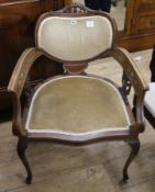 An Edwardian walnut and marquetry open armchair, with kidney shaped back, padded seat and cabriole