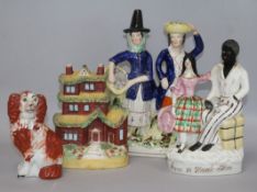 Two Staffordshire pottery figures groups of a dog and a castle tallest 26cm