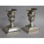 A pair of Victorian silver dwarf candlesticks, Sheffield, 1876, 11cm.