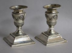 A pair of Victorian silver dwarf candlesticks, Sheffield, 1876, 11cm.