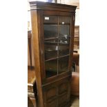 A glazed oak corner cupboard W.69cm