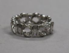 A modern 18ct white gold and diamond set pierced 'eternity' ring, size M.