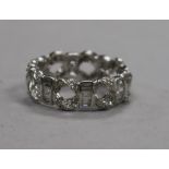 A modern 18ct white gold and diamond set pierced 'eternity' ring, size M.