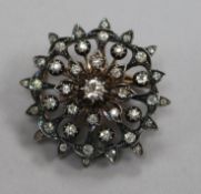 A Victorian yellow and white metal, diamond set flower head pendant brooch, 36mm.