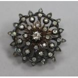 A Victorian yellow and white metal, diamond set flower head pendant brooch, 36mm.