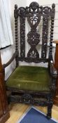 A late 19th century walnut throne chair, with carving matching that on the table selling as Lot