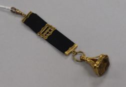 A 9ct gold and citrine set fob seal, on a 9ct gold mounted sash pendant.
