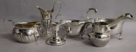 A demi fluted silver cream jug, a 1930's silver sparrow beak jug, two silver sauceboats, a silver