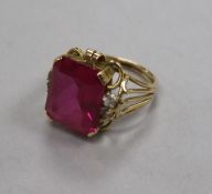A yellow metal and synthetic ruby? dress ring, size M.