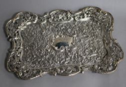 An Edwardian repousse silver dressing table tray by Matthew John Jessop, London, 1902, 31.8cm, 9.5