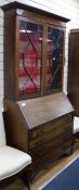 A Sheraton revival inlaid mahogany bureau bookcase W.99cm