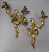 A pair of bronze two branch wall lights height 42cm