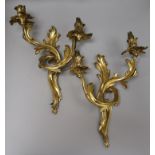 A pair of bronze two branch wall lights height 42cm