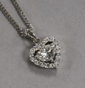 A modern 18ct white gold and diamond heart shaped pendant, on an 18ct white gold chain, pendant