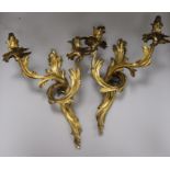 A pair of bronze two branch wall lights height 42cm