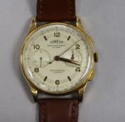 A gentleman's Coresa 18ct gold chronograph wrist watch.