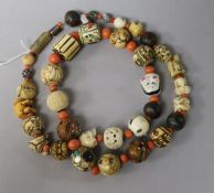 A Japanese assorted ojime and coral bead necklace, 72cm.