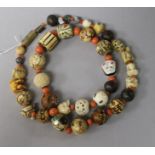 A Japanese assorted ojime and coral bead necklace, 72cm.