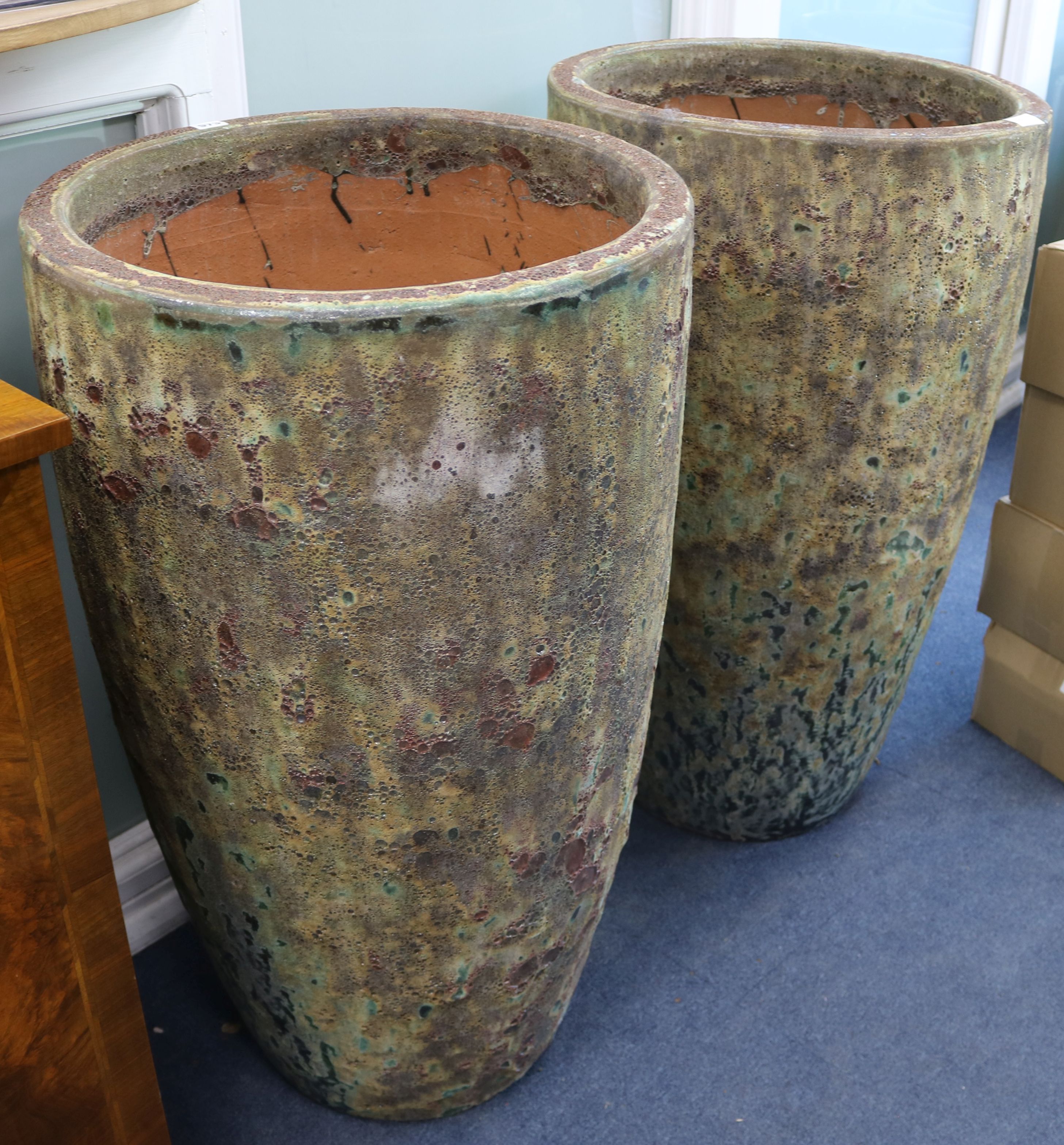 A pair of large Volcanic style pots W.55cm