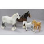 A collection of four Beswick Horses: Shire mare grey 818, Shire mare brown 818, Shire foal