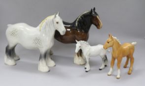 A collection of four Beswick Horses: Shire mare grey 818, Shire mare brown 818, Shire foal