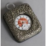 An Edwardian repousse silver mounted travelling watch case with Swiss silver pocket watch.