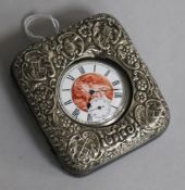 An Edwardian repousse silver mounted travelling watch case with Swiss silver pocket watch.